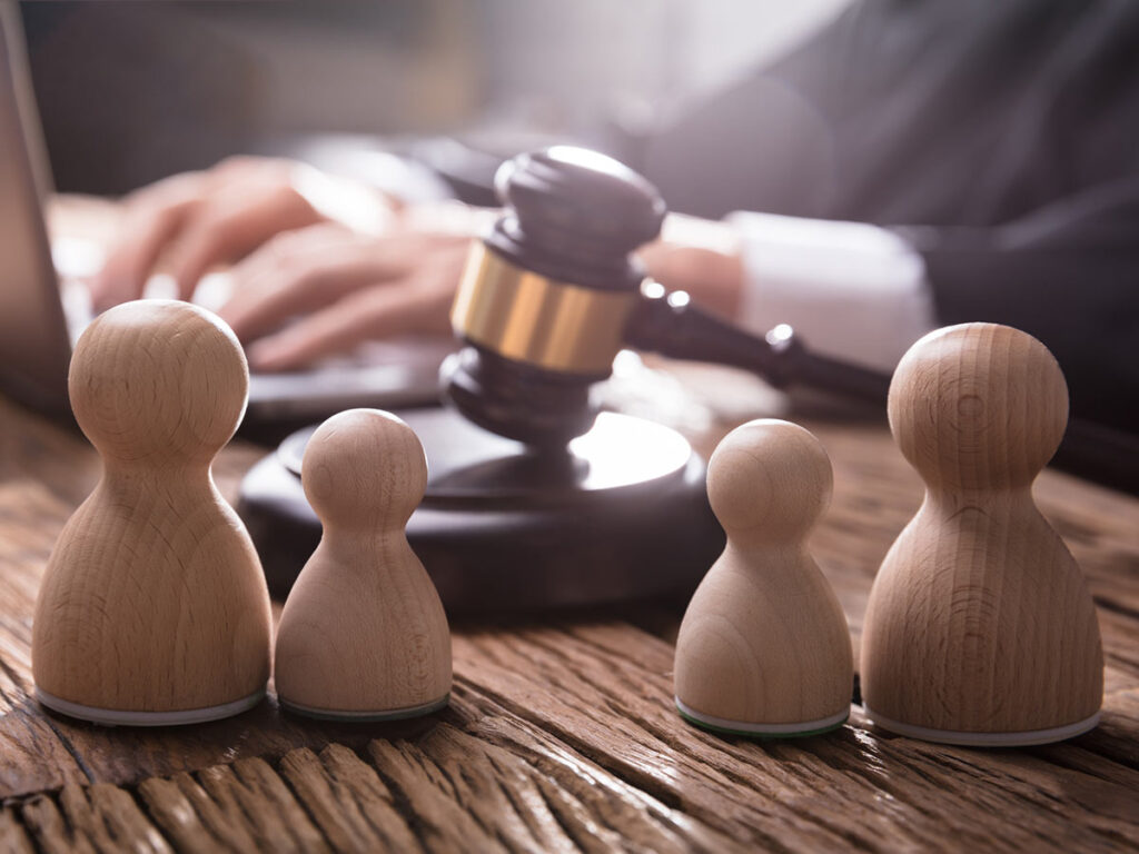 Family wooden figures with gavel