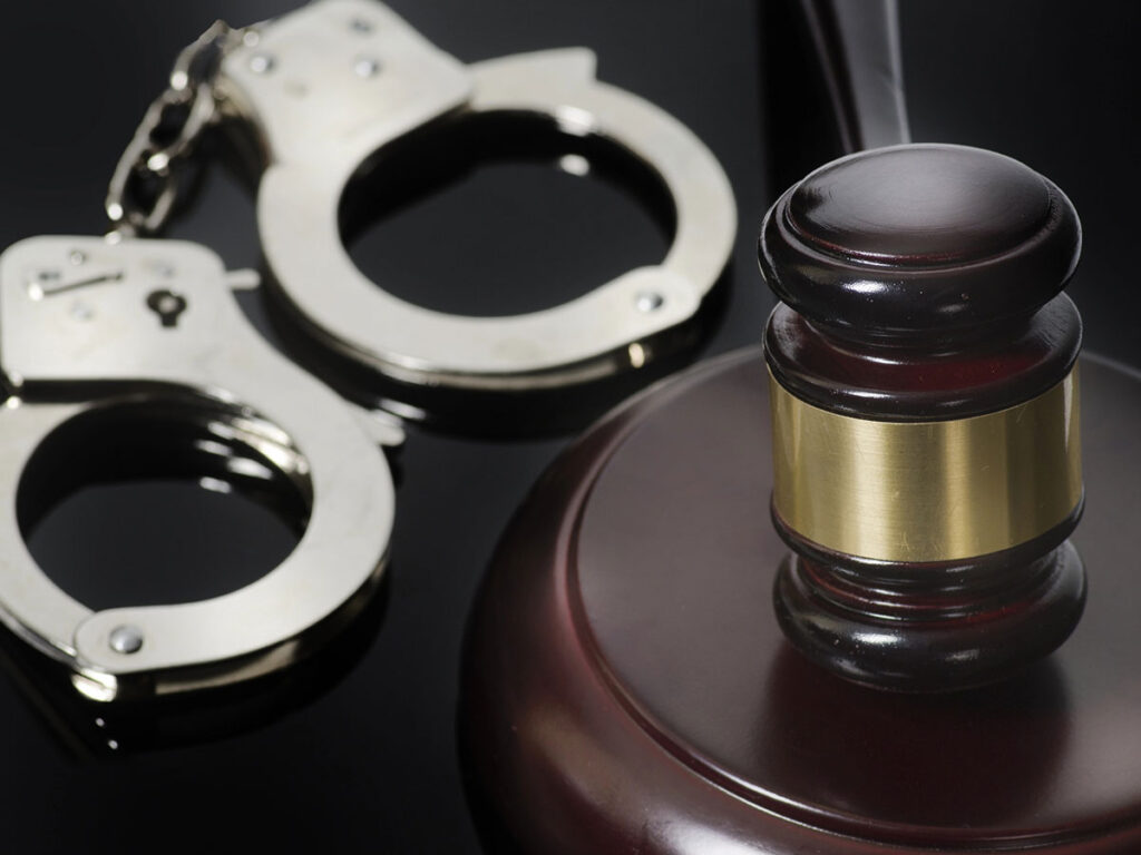 Gavel and handcuffs concept image